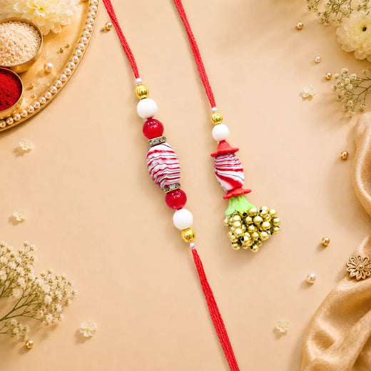 Pair Rakhi - Red Flower and White Beads Golden Bunch