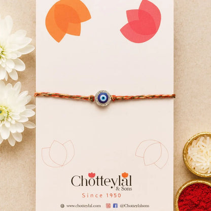 Nazariya Grace – Silver Rakhi with Colorful Stone Thread