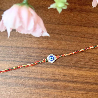 Nazariya Grace – Silver Rakhi with Colorful Stone Thread