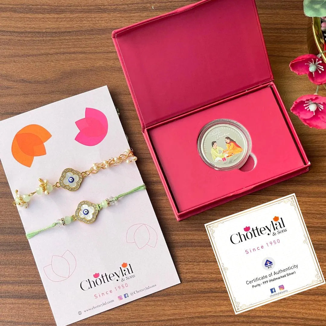 Combo: Happy Rakhi Gift - Brother Sister Coin (10 Gram) + 2 Rakhi - 999 Purity Silver Coin