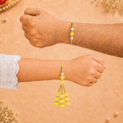 Pair Rakhi - Beautiful Yellow Flower Design