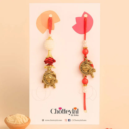 Pair Rakhi - Red Flower and White Beads Design