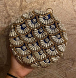 Round shape pearl and golden moli work purse